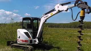 Аренда экскаватора погрузчика с ямобуром в Североморск цена от 1562 руб